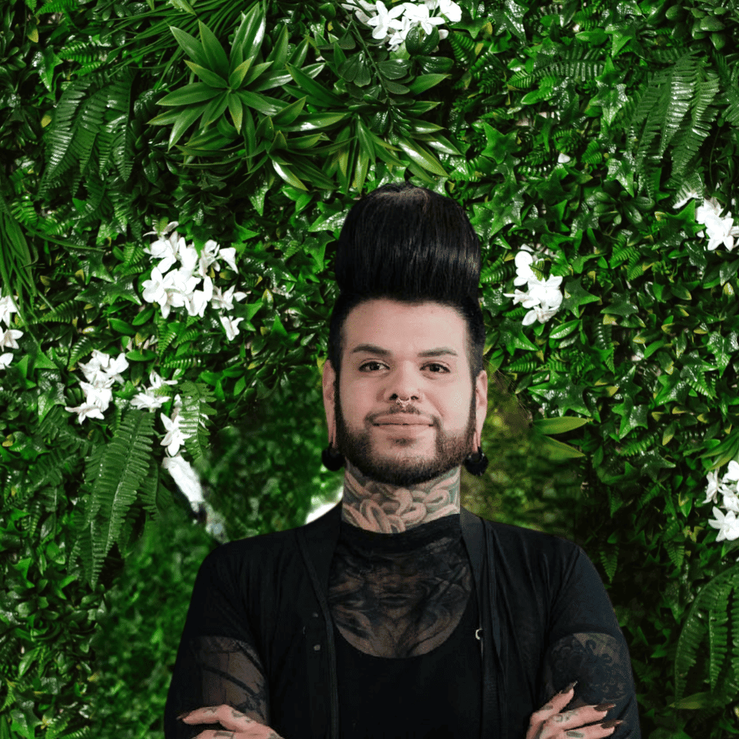 Portrait of Joey, a professional stylist at Utopia Salon, showcasing their expertise and style.