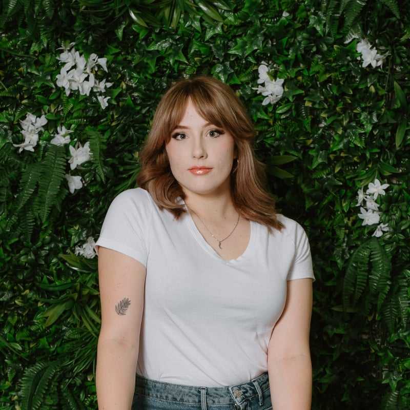 Portrait of Soph, a professional stylist at Utopia Salon, showcasing their expertise and style.