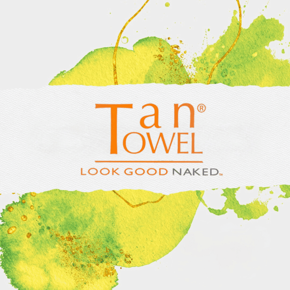 Tan Towel logo with the tagline "LOOK GOOD NAKED" on a watercolor splashed background.