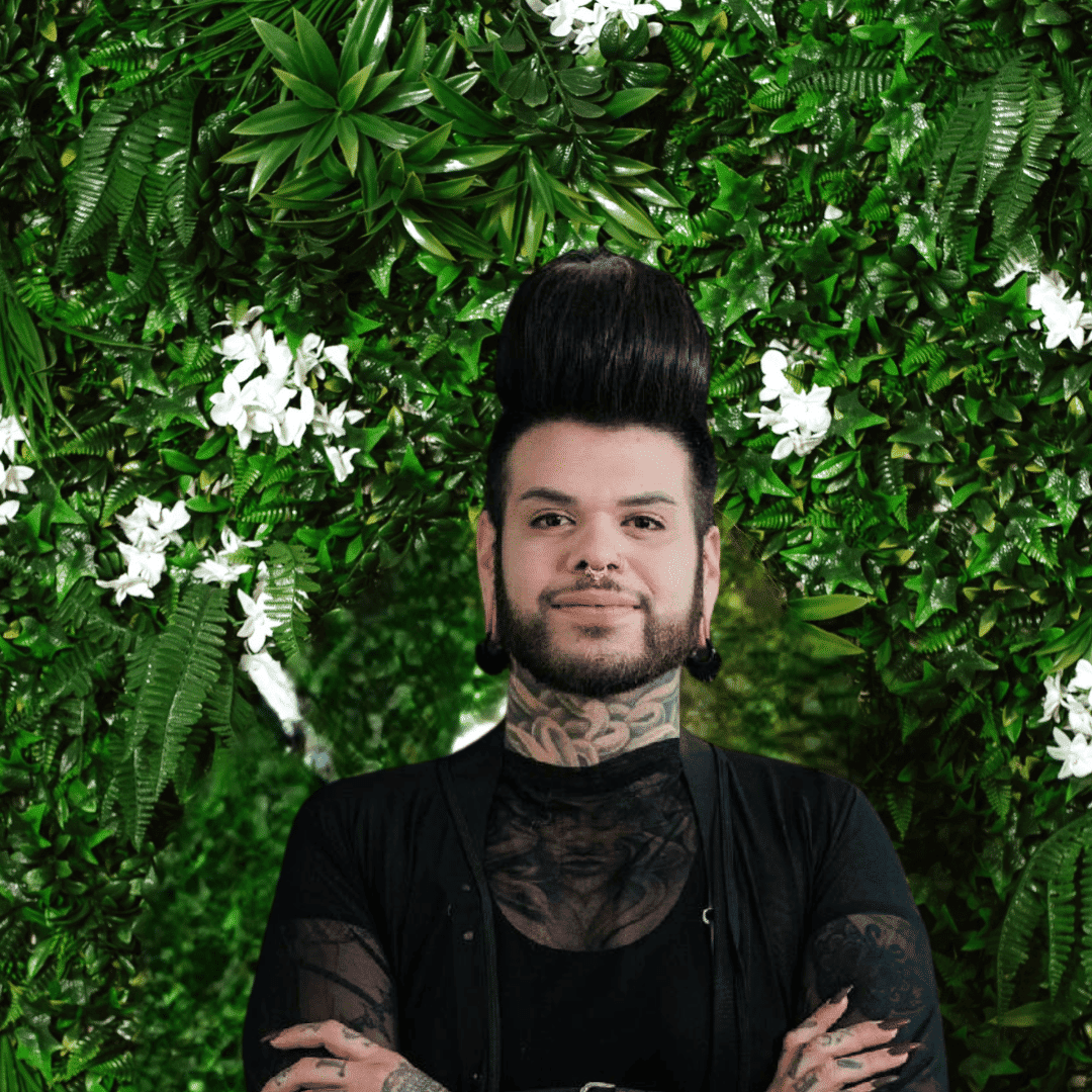 Portrait of Joey, a professional stylist at Utopia Salon, showcasing their expertise and style.