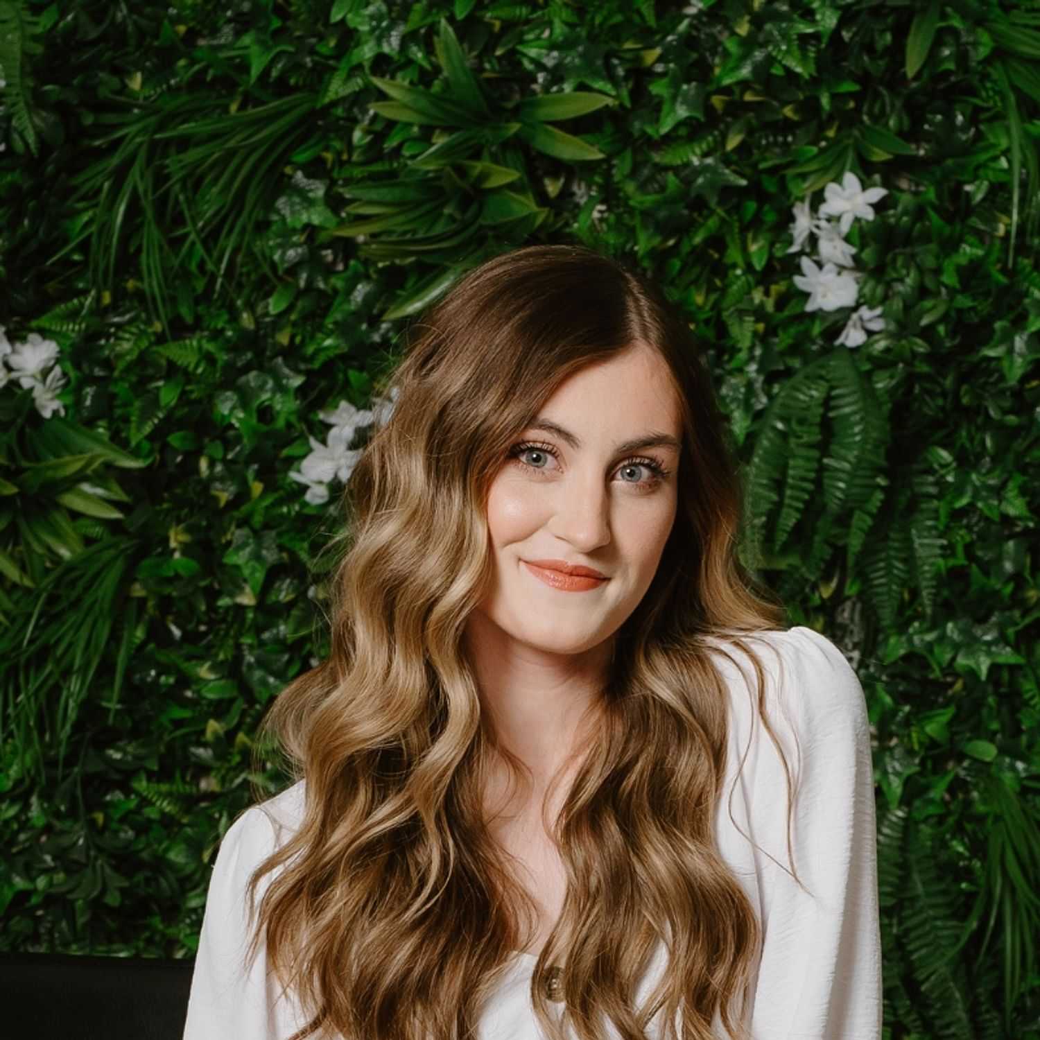 Portrait of Katrina, a professional stylist at Utopia Salon, showcasing their expertise and style.