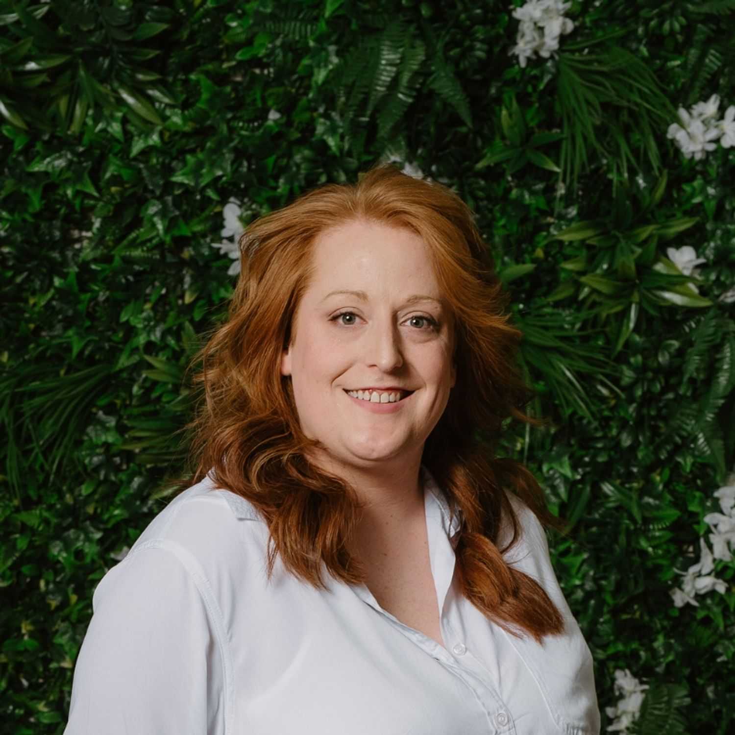 Portrait of Jessie, a professional stylist at Utopia Salon, showcasing their expertise and style.