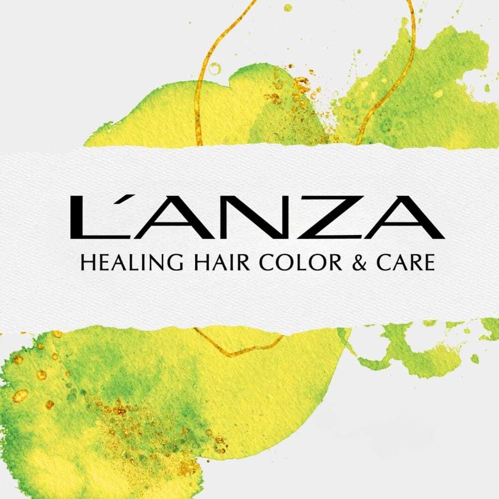 L'ANZA logo with "Healing Hair Color & Care" text on a splash of green and yellow paint background.