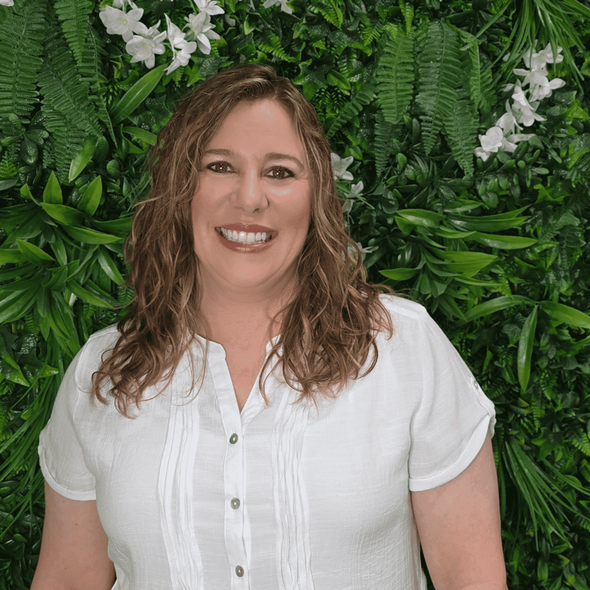 Portrait of Andi, a professional stylist at Utopia Salon, showcasing their expertise and style.