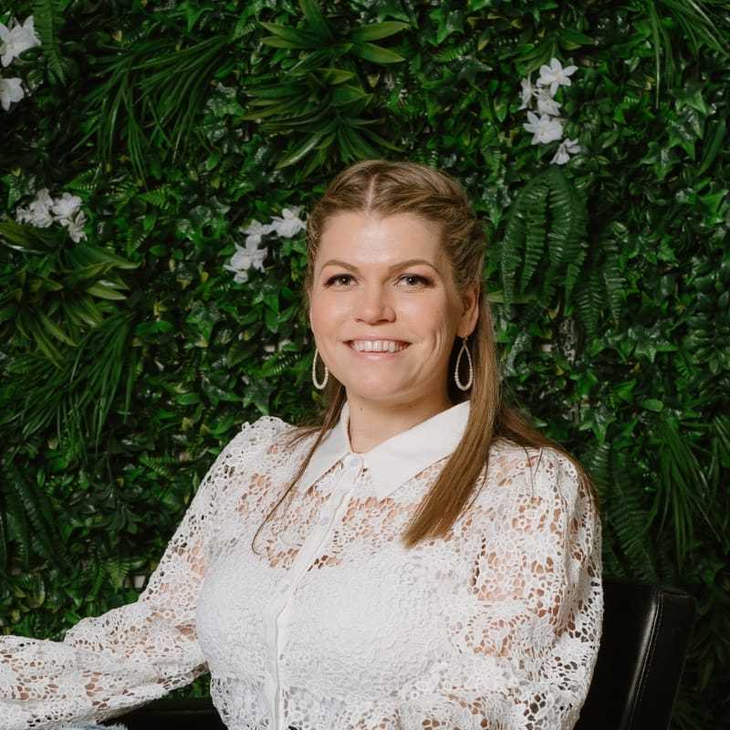 Portrait of Olga, a professional stylist at Utopia Salon, showcasing their expertise and style.