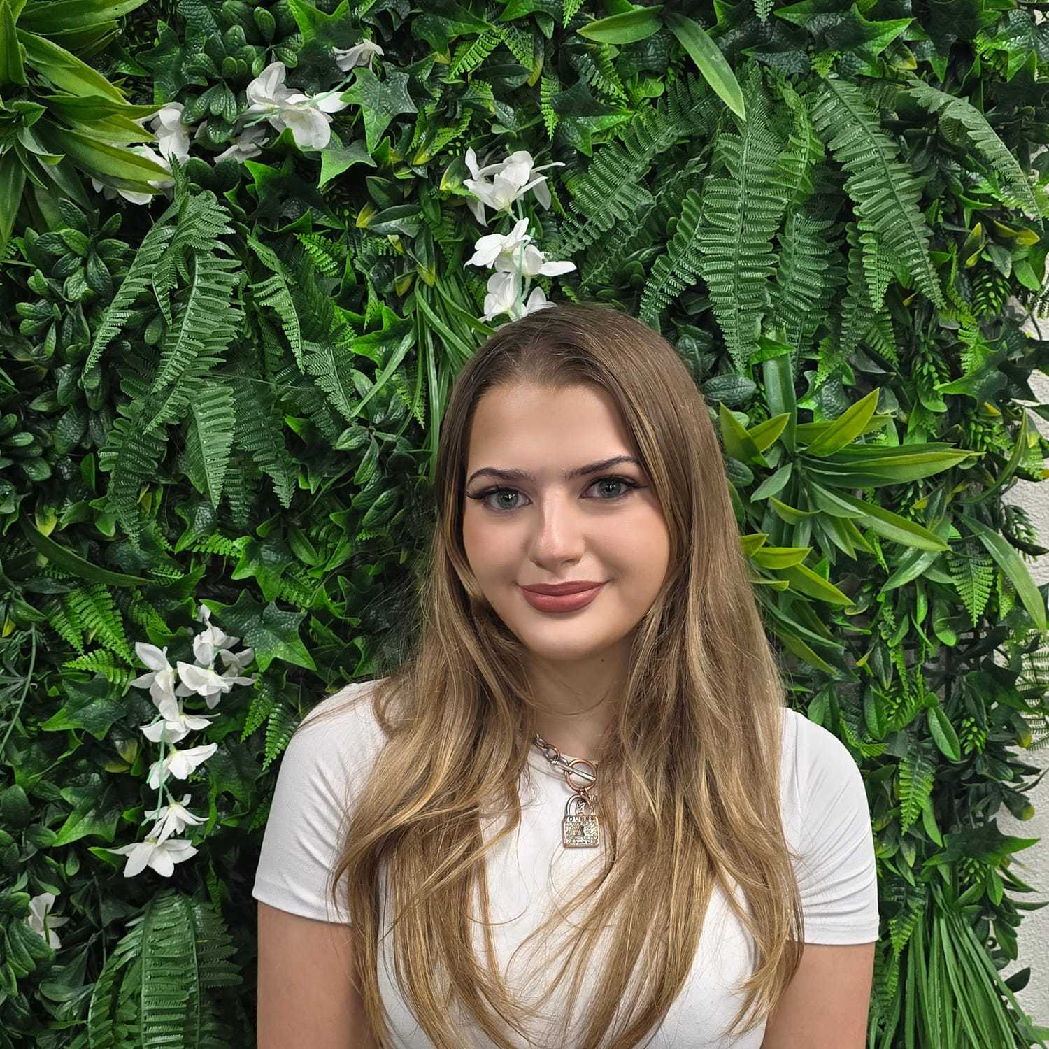 Portrait of Margaux, a professional stylist at Utopia Salon, showcasing their expertise and style.