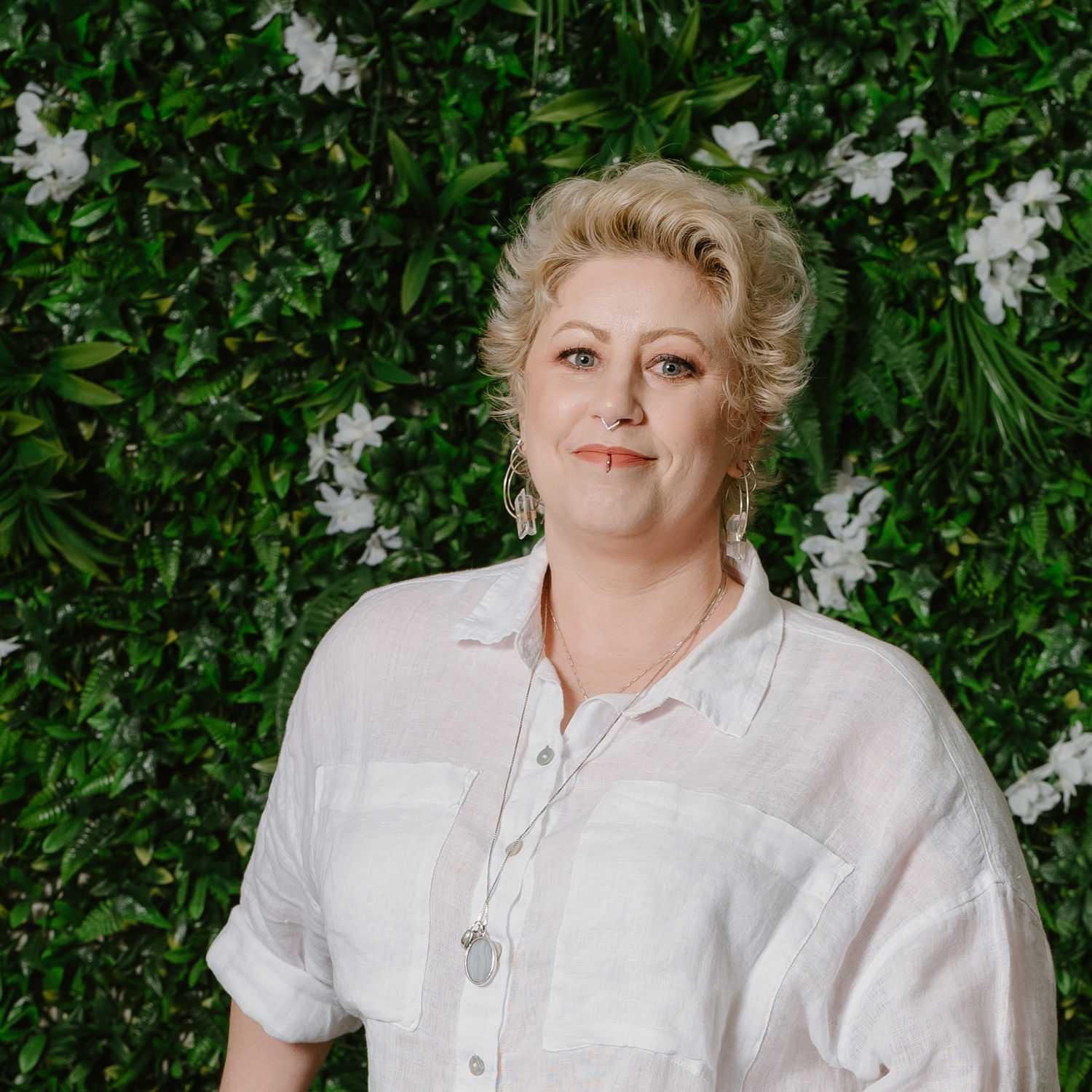 Portrait of Lacey, a professional stylist at Utopia Salon, showcasing their expertise and style.