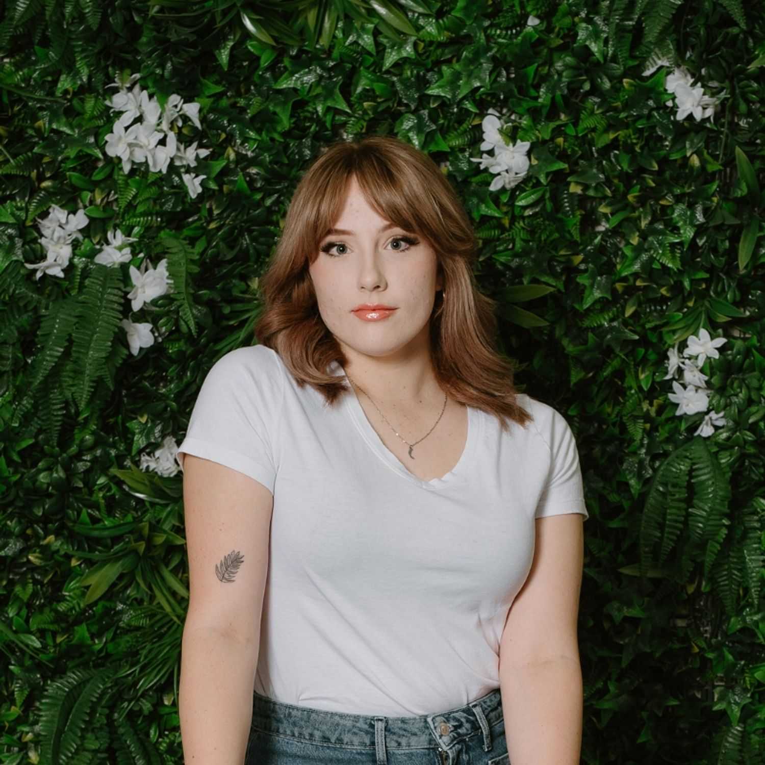 Portrait of Sophie, a professional stylist at Utopia Salon, showcasing their expertise and style.