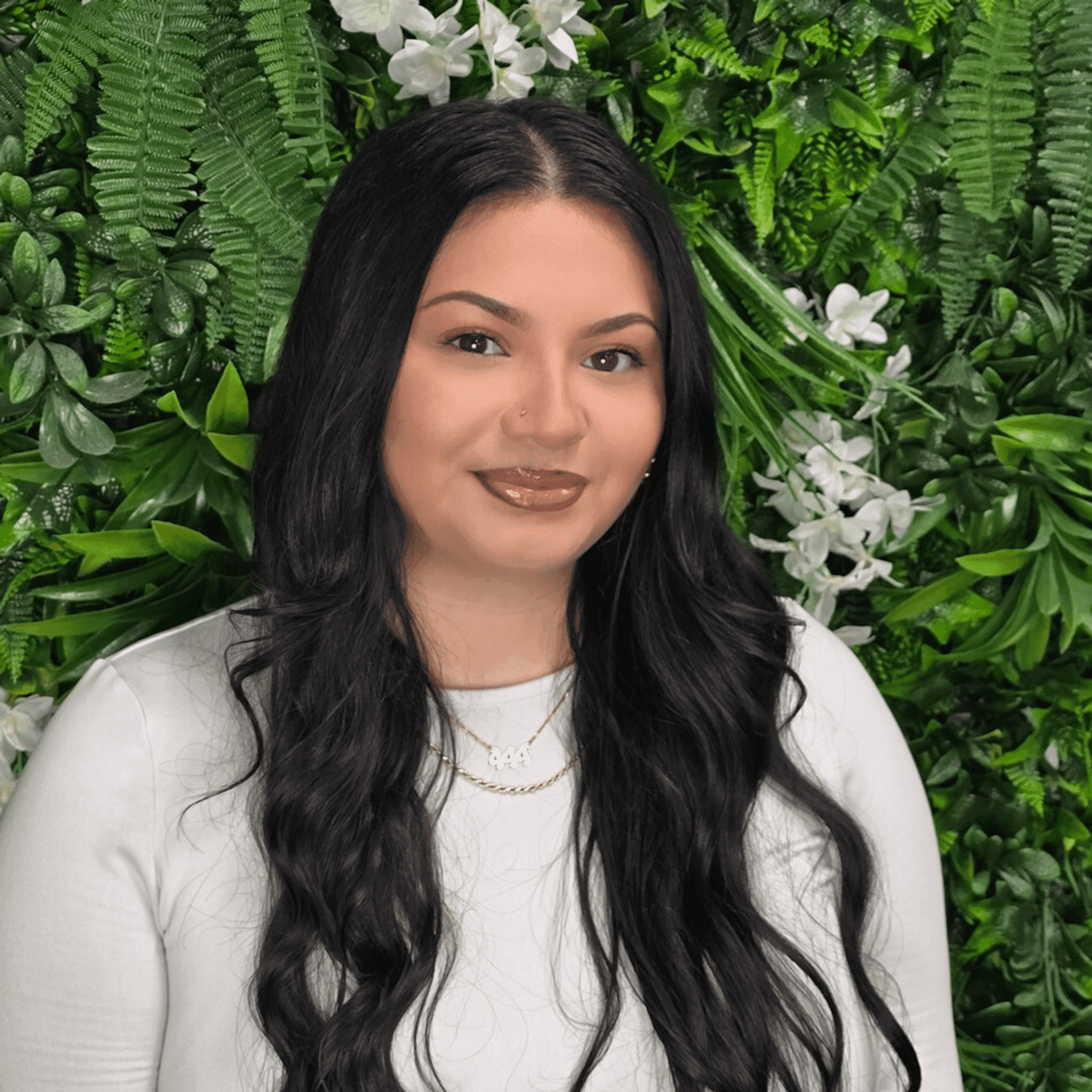 Portrait of Gaya, a professional stylist at Utopia Salon, showcasing their expertise and style.