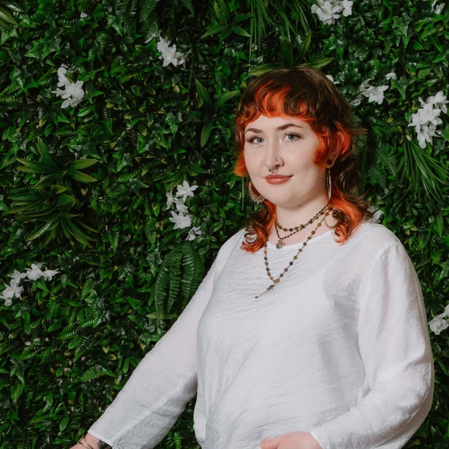 Portrait of Gabby, a professional stylist at Utopia Salon, showcasing their expertise and style.