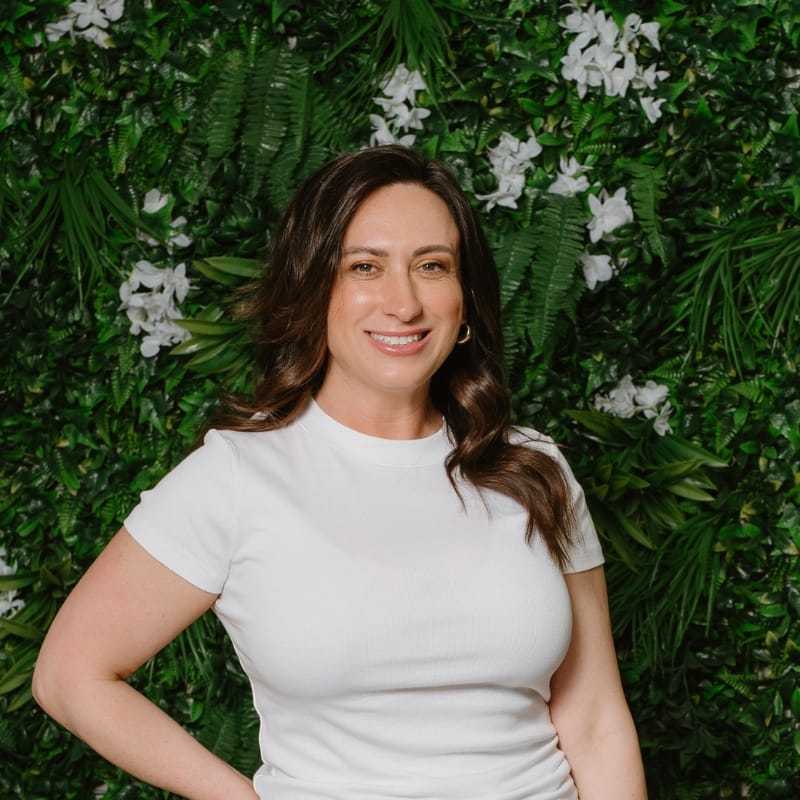 Portrait of Jenifer Michelle, a professional stylist at Utopia Salon, showcasing their expertise and style.