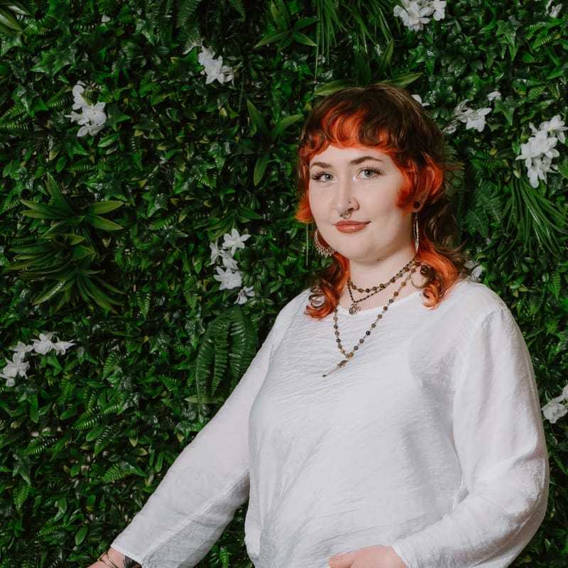 Portrait of Gabby, a professional stylist at Utopia Salon, showcasing their expertise and style.