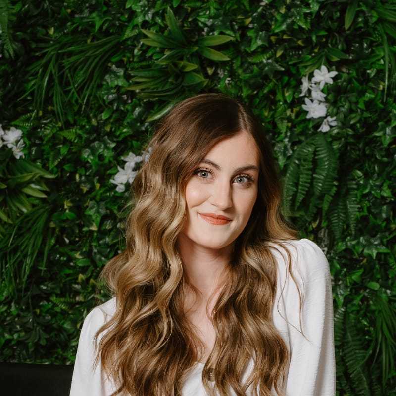 Portrait of Katrina, a professional stylist at Utopia Salon, showcasing their expertise and style.